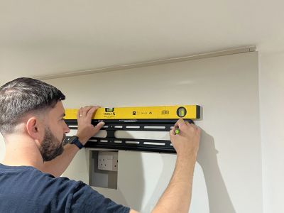 TV Wall Mount Bracket being installed